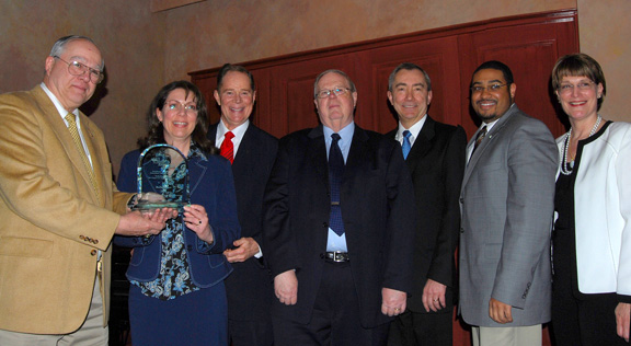 Rolls-Royce team accepting award from Ray Morrison.